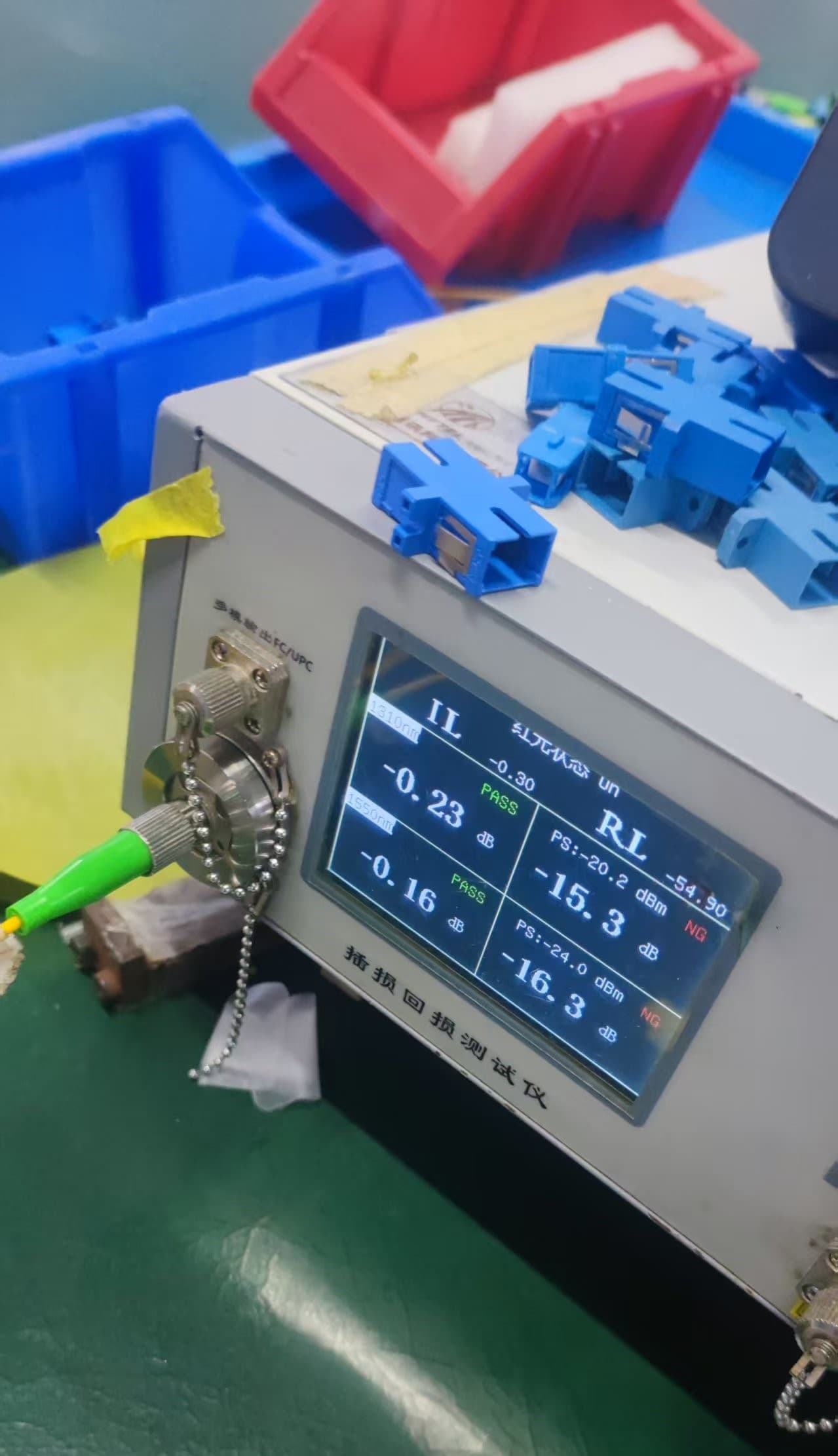 Insertion loss and return loss test set showing PASS/NG results for fiber patch cords