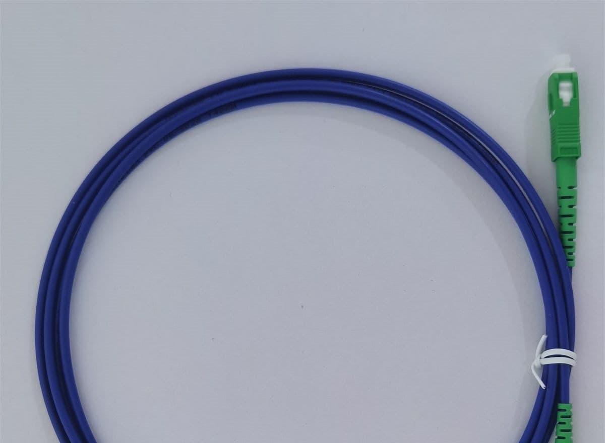 Blue SC/APC single mode simplex fiber patch cord coil with green connectors